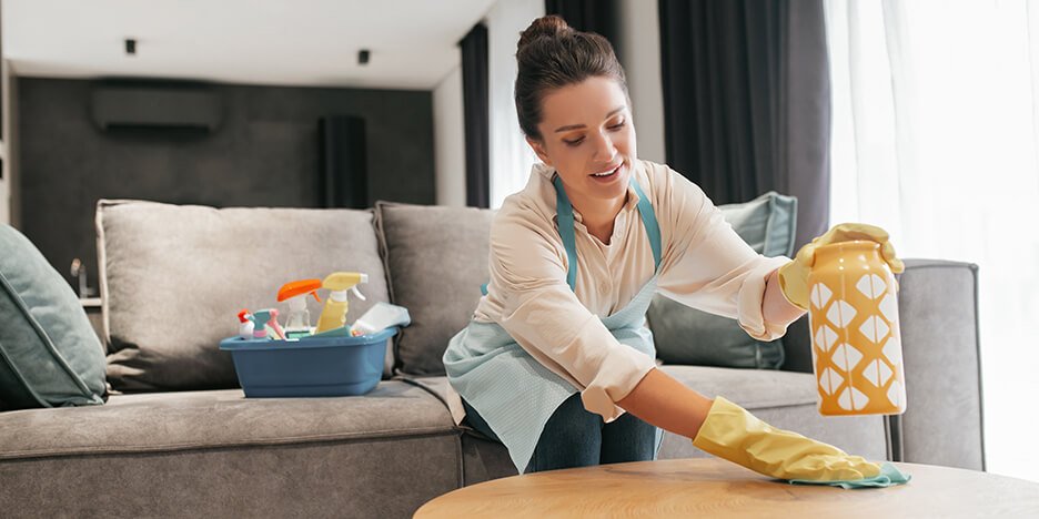 Professional cleaner meticulously scrubbing a bathroom